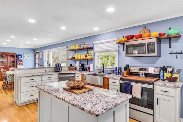 505 Kindel Dr, Decherd, TN 37324 - kitchen featuring appliances with stainless steel finishes, open shelves, a sink, white cabinetry, and recessed lighting