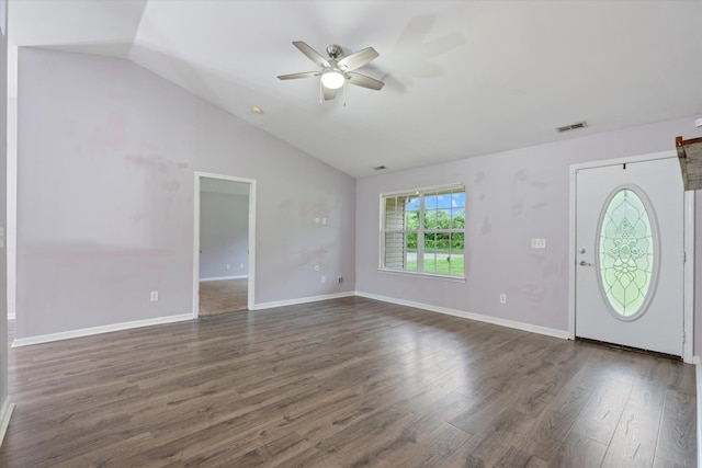 foyer entrance featuring a ceiling fan, dark wood finished floors, vaulted ceiling, and baseboards
