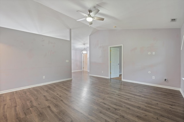 unfurnished room featuring ceiling fan, lofted ceiling, baseboards, and dark wood-style floors