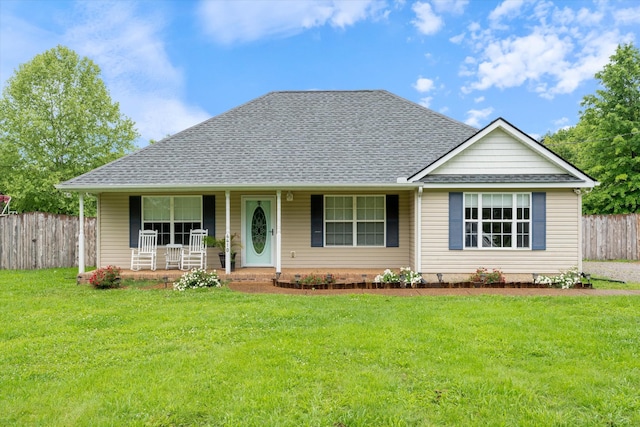 view of front facade with a shingled roof and a porch