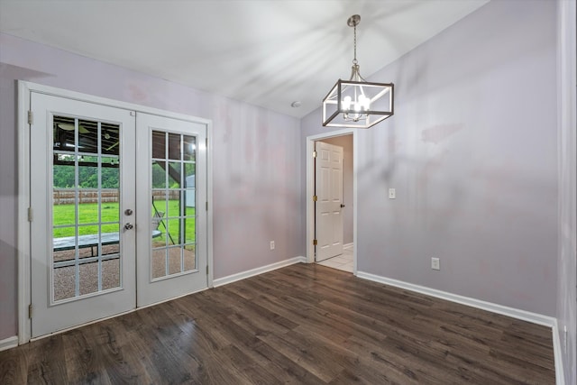 doorway featuring baseboards, a chandelier, dark wood-style floors, and french doors