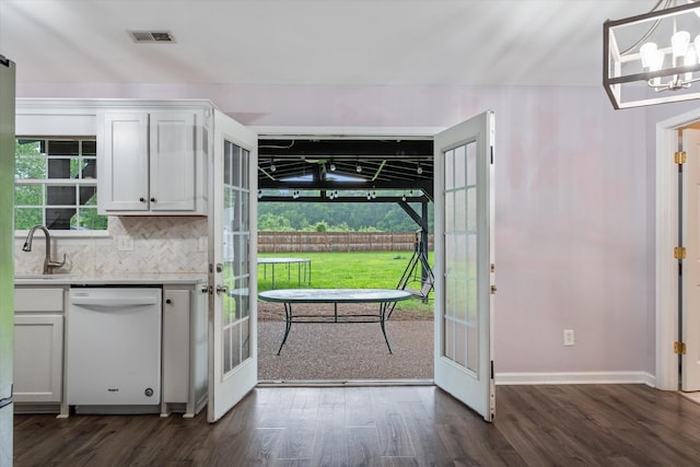 entryway with a sink, french doors, dark wood finished floors, and baseboards