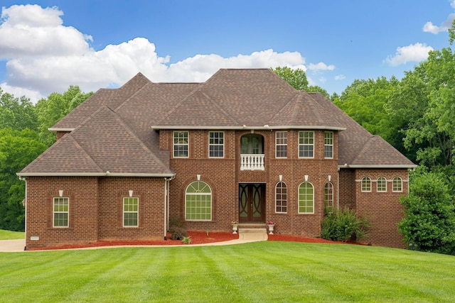 291 Bowling Branch Rd, Cottontown, TN 37048 - colonial inspired home with brick siding, a front yard, and a shingled roof
