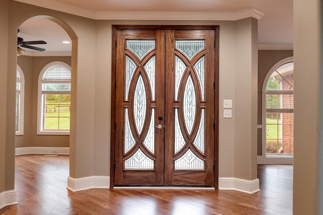 291 Bowling Branch Rd, Cottontown, TN 37048 - foyer entrance with ornamental molding, wood finished floors, baseboards, a ceiling fan, and arched walkways