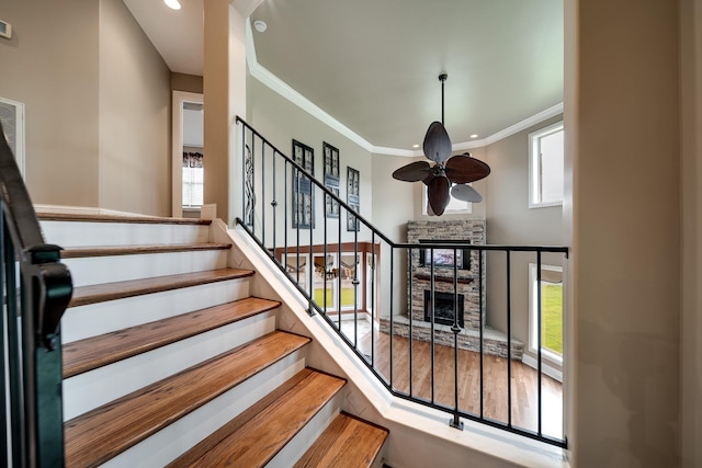 291 Bowling Branch Rd, Cottontown, TN 37048 - stairs featuring ceiling fan, healthy amount of natural light, crown molding, a fireplace, and recessed lighting