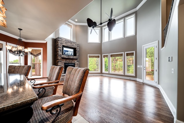 291 Bowling Branch Rd, Cottontown, TN 37048 - office space with a chandelier, a stone fireplace, crown molding, wood finished floors, and baseboards