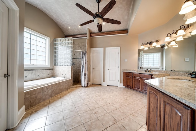 291 Bowling Branch Rd, Cottontown, TN 37048 - bathroom with vaulted ceiling, healthy amount of natural light, tile patterned floors, vanity, and ceiling fan