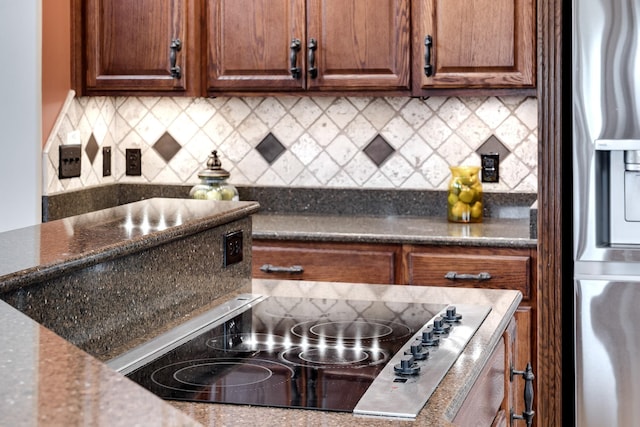 291 Bowling Branch Rd, Cottontown, TN 37048 - kitchen featuring stainless steel fridge, decorative backsplash, and black electric cooktop