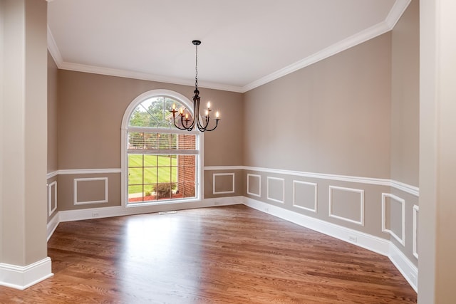 291 Bowling Branch Rd, Cottontown, TN 37048 - empty room featuring a chandelier, wood finished floors, crown molding, and a wainscoted wall