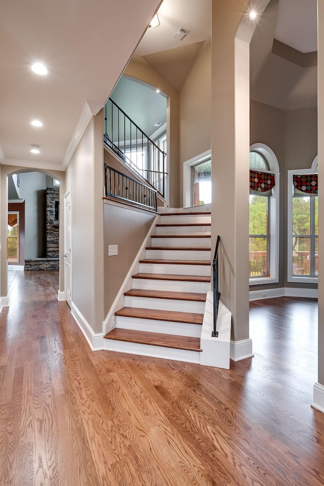 291 Bowling Branch Rd, Cottontown, TN 37048 - staircase featuring arched walkways, wood finished floors, baseboards, plenty of natural light, and ornamental molding