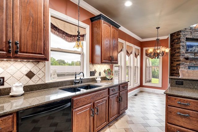 291 Bowling Branch Rd, Cottontown, TN 37048 - kitchen featuring dishwasher, a sink, decorative light fixtures, dark stone countertops, and baseboards