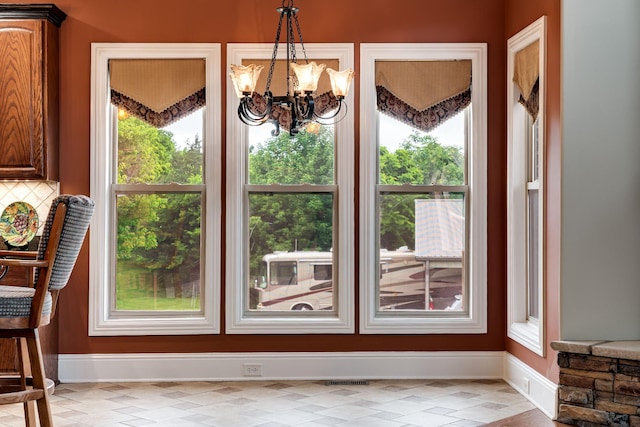 291 Bowling Branch Rd, Cottontown, TN 37048 - unfurnished dining area with baseboards, plenty of natural light, and a chandelier