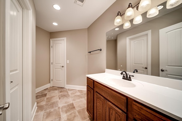 291 Bowling Branch Rd, Cottontown, TN 37048 - bathroom featuring vanity, baseboards, and recessed lighting
