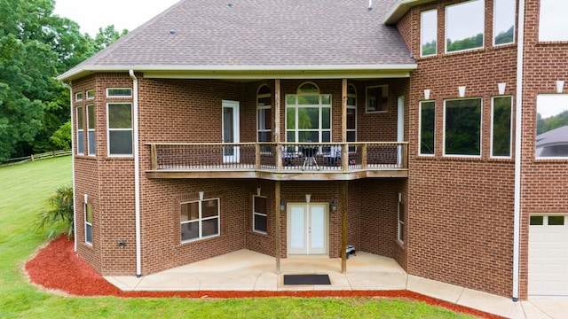 291 Bowling Branch Rd, Cottontown, TN 37048 - rear view of house featuring brick siding, a shingled roof, a patio, and a balcony
