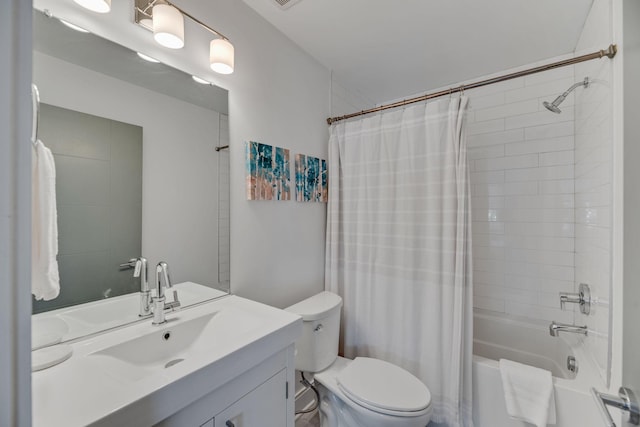 full bathroom featuring shower / tub combo with curtain, toilet, and vanity