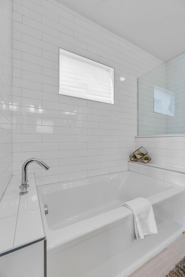 bathroom with a garden tub