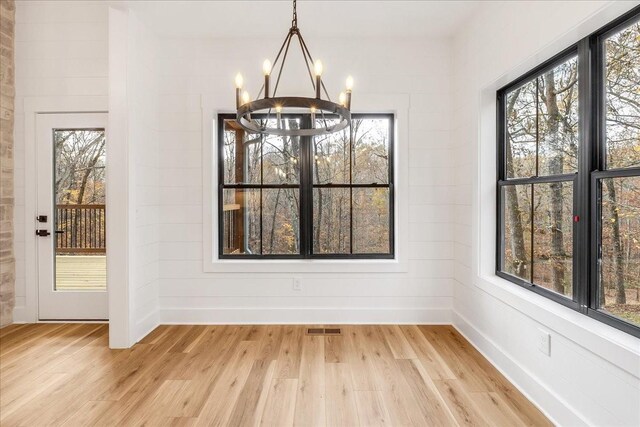 113 Lake Crest Ln, Tullahoma, TN 37388 - unfurnished dining area featuring a chandelier, light wood finished floors, and healthy amount of natural light