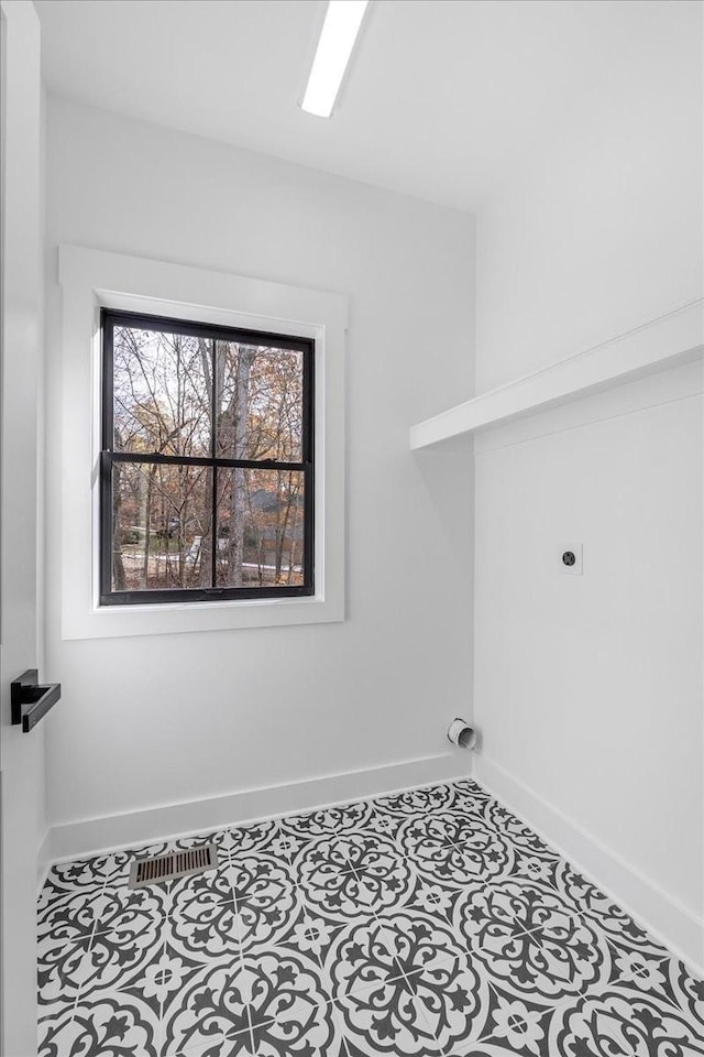 113 Lake Crest Ln, Tullahoma, TN 37388 - washroom featuring electric dryer hookup, baseboards, and tile patterned flooring