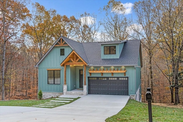 113 Lake Crest Ln, Tullahoma, TN 37388 - modern farmhouse featuring driveway, roof with shingles, an attached garage, board and batten siding, and stone siding