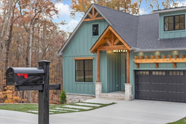 113 Lake Crest Ln, Tullahoma, TN 37388 - modern inspired farmhouse with board and batten siding, roof with shingles, driveway, and a garage