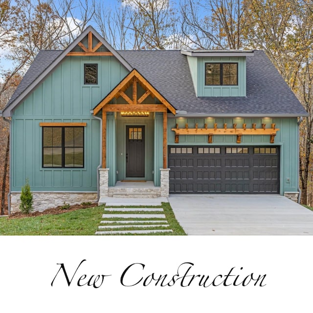 113 Lake Crest Ln, Tullahoma, TN 37388 - modern inspired farmhouse featuring board and batten siding, a shingled roof, driveway, and stone siding