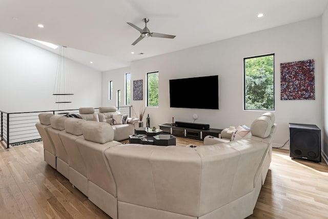 living area with a ceiling fan, light wood-style floors, recessed lighting, and lofted ceiling