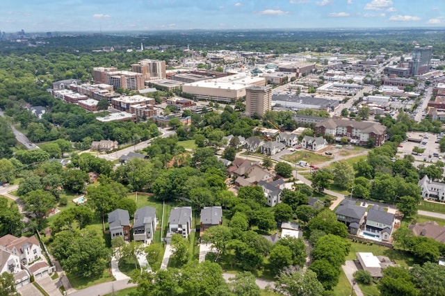 aerial view of property's location with nearby urban area