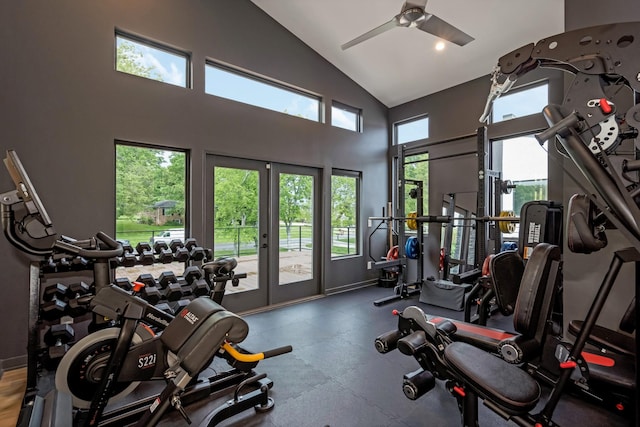 exercise room with a ceiling fan and high vaulted ceiling