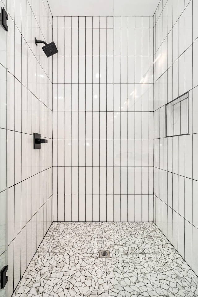 full bath with a shower stall