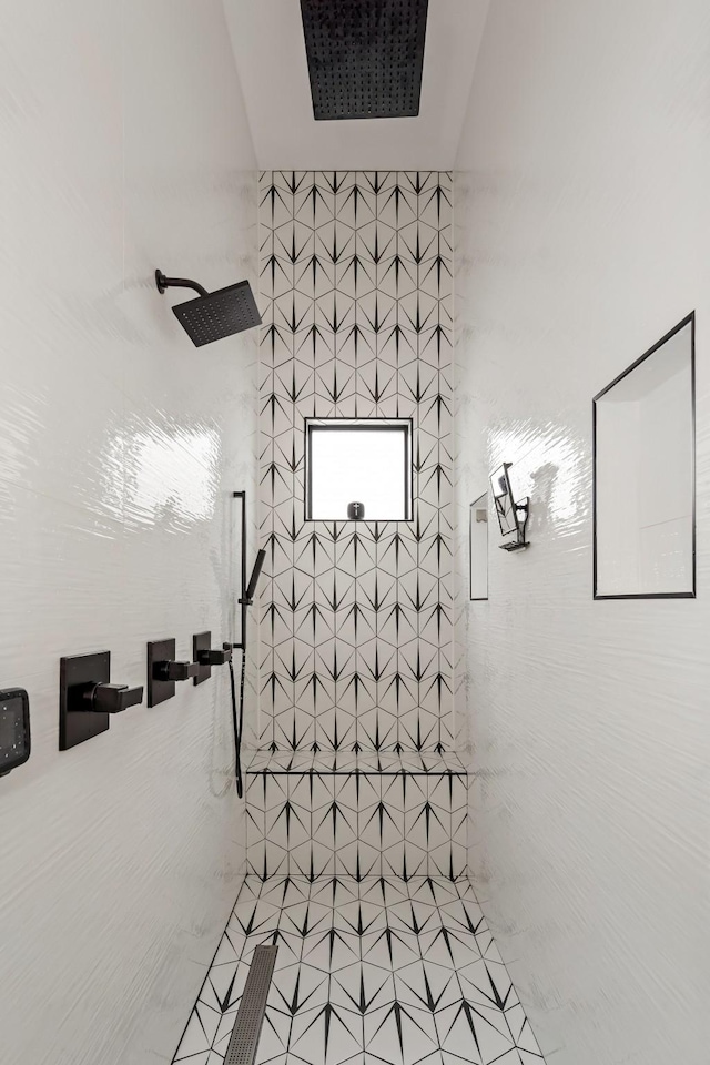 bathroom with tiled shower
