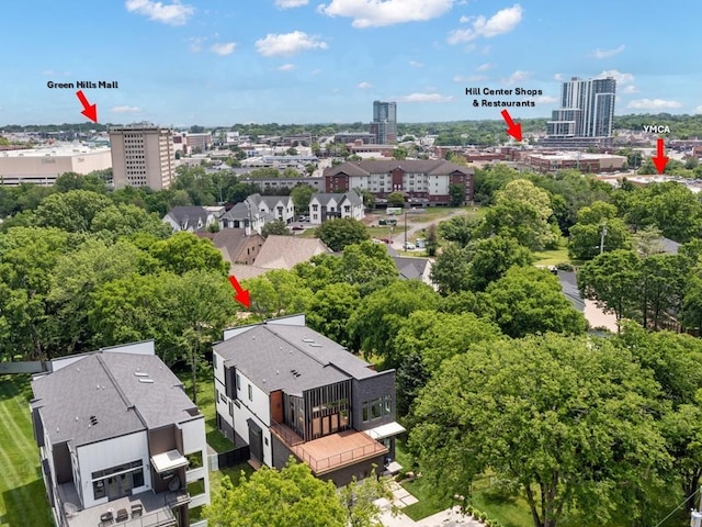view of urban area featuring a tree filled landscape