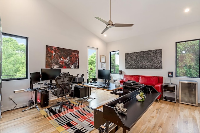 office area with wood finished floors, ceiling fan, recessed lighting, and high vaulted ceiling