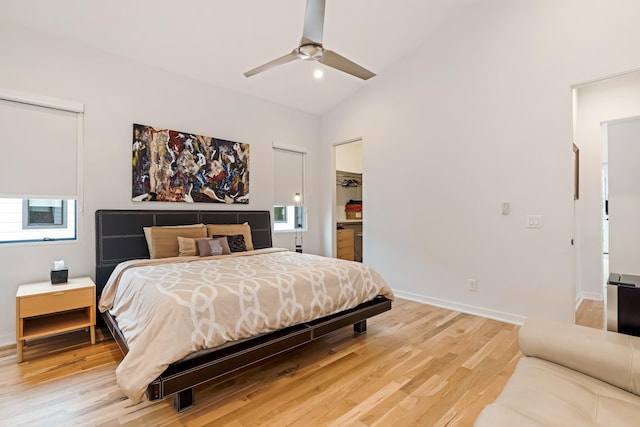 bedroom with lofted ceiling, light wood-type flooring, baseboards, and ceiling fan