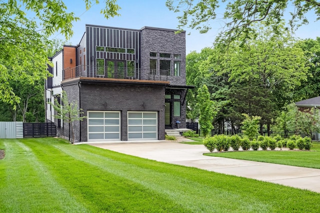 modern home with a balcony, a garage, driveway, and brick siding