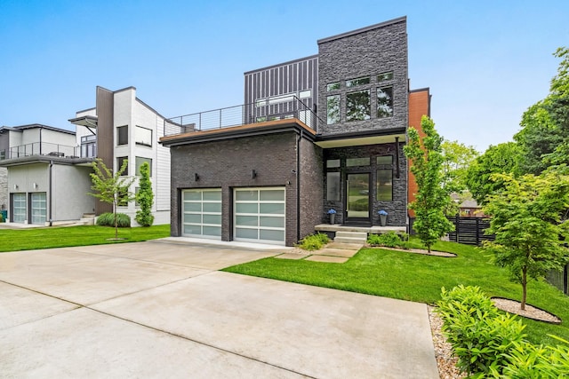 view of front of house with a balcony, driveway, an attached garage, and stone siding