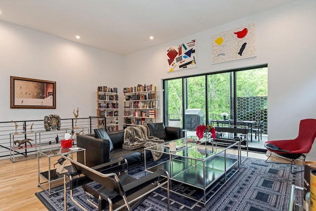living room with wood finished floors and recessed lighting