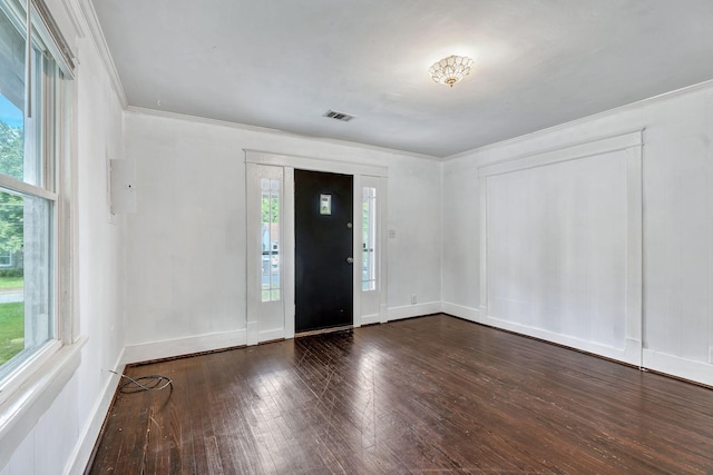 foyer featuring plenty of natural light, dark wood-style flooring, crown molding, and baseboards