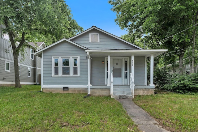 bungalow featuring covered porch, a front yard, and crawl space