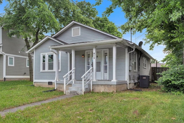 view of front of house with cooling unit and covered porch
