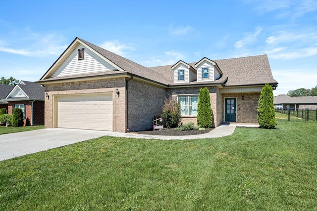 238 Spring Breeze Dr, Tullahoma, TN 37388 - view of front of home with brick siding, a garage, and concrete driveway
