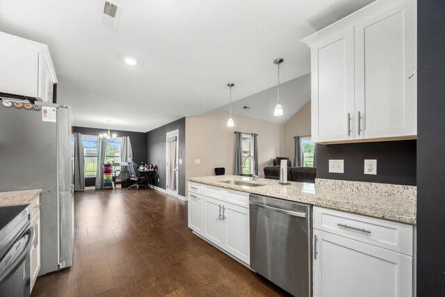 238 Spring Breeze Dr, Tullahoma, TN 37388 - kitchen with stainless steel appliances, a sink, a chandelier, white cabinetry, and a peninsula