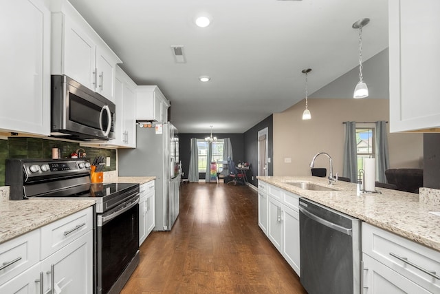 238 Spring Breeze Dr, Tullahoma, TN 37388 - kitchen featuring appliances with stainless steel finishes, a sink, white cabinets, dark wood finished floors, and a chandelier