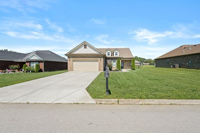 238 Spring Breeze Dr, Tullahoma, TN 37388 - view of front facade featuring brick siding, a front yard, concrete driveway, and a garage