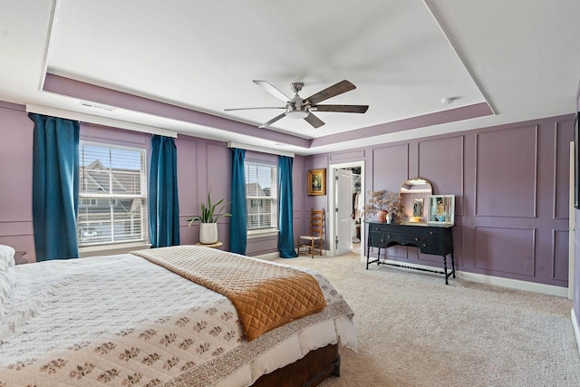 1125 Clendening Dr, Gallatin, TN 37066 - bedroom featuring a raised ceiling, light colored carpet, a ceiling fan, a decorative wall, and a closet