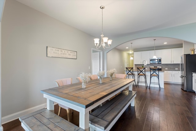 1500 Cedarbrooke Ln, Lebanon, TN 37090 - dining area featuring arched walkways, recessed lighting, dark wood-type flooring, a chandelier, and baseboards