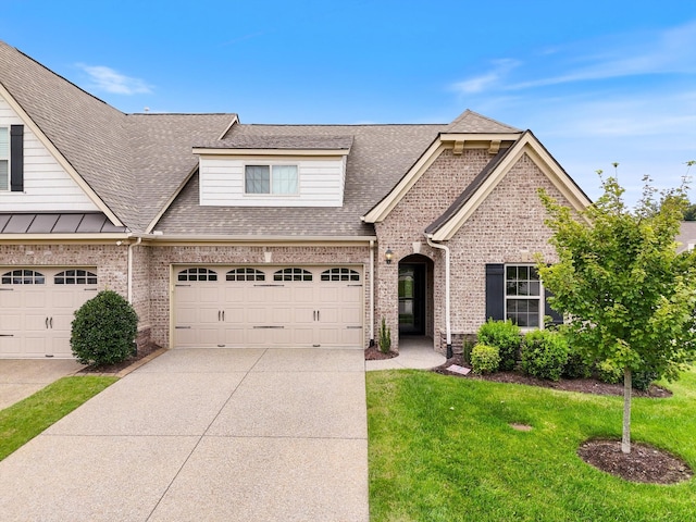 1500 Cedarbrooke Ln, Lebanon, TN 37090 - view of front of house featuring brick siding, concrete driveway, a shingled roof, and a front lawn