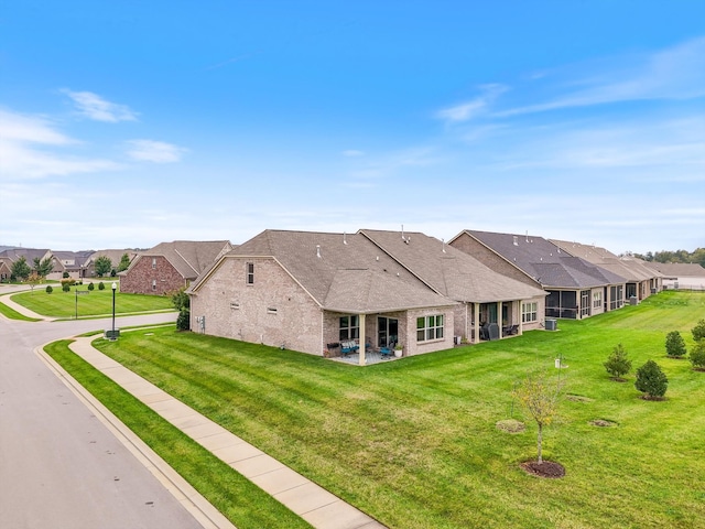 1500 Cedarbrooke Ln, Lebanon, TN 37090 - back of property with brick siding, a residential view, a lawn, and roof with shingles