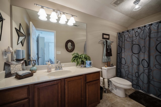 bathroom featuring vanity, toilet, a shower with shower curtain, and vaulted ceiling