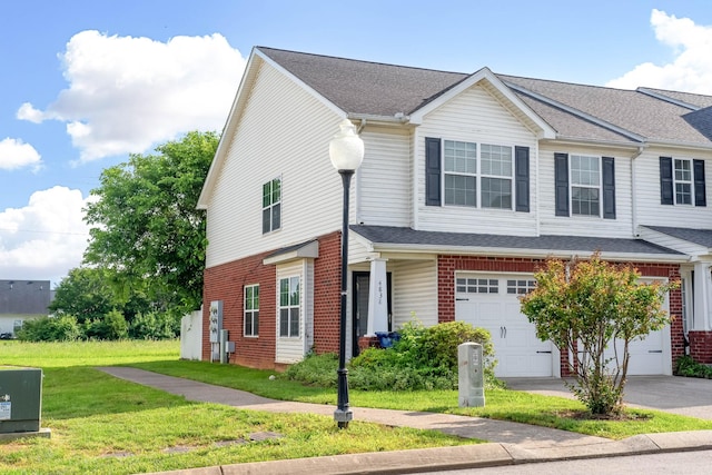 4838 Laura Jeanne Blvd, Murfreesboro, TN 37129 - townhome / multi-family property featuring a garage, asphalt driveway, a front yard, and brick siding