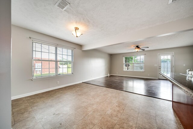4838 Laura Jeanne Blvd, Murfreesboro, TN 37129 - tiled spare room featuring a textured ceiling, a ceiling fan, and baseboards